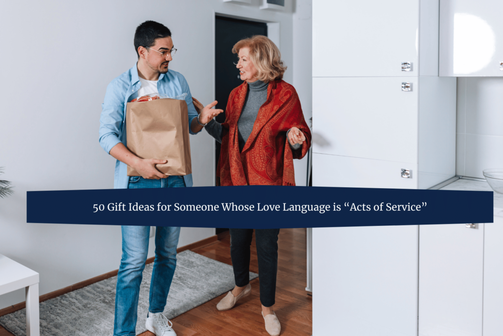 A man holding a grocery bag offers help to an older woman in her home. She gestures toward him while they engage in conversation, reflecting an act of service in everyday life.